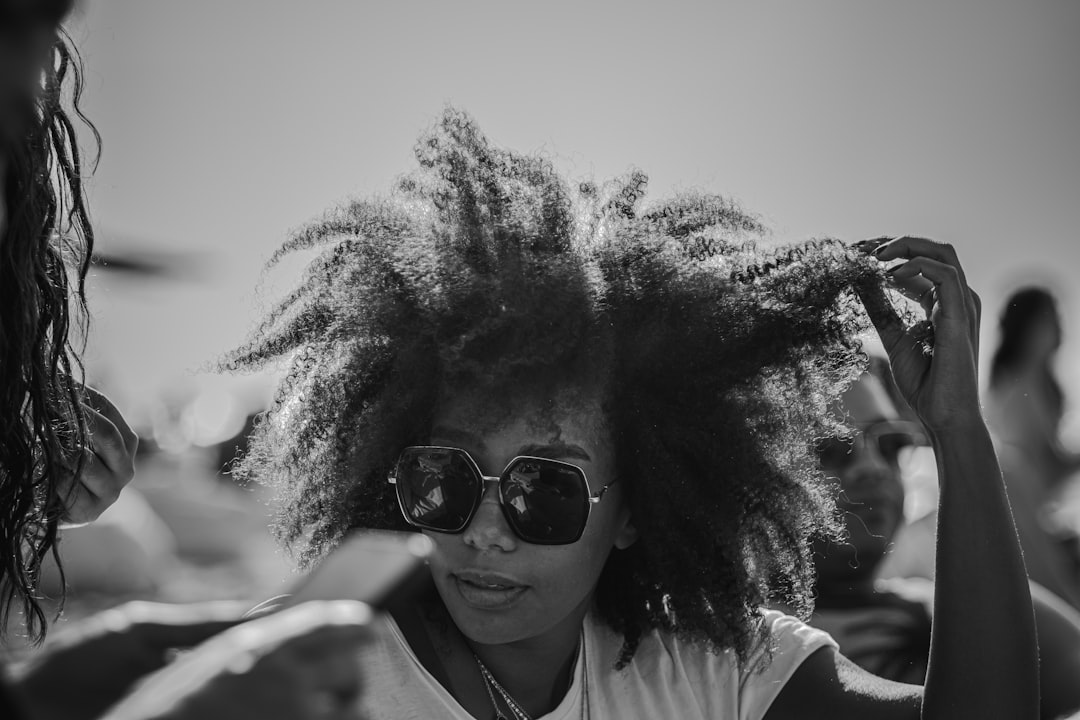 Crafting Captivating Headlines: Your awesome post title goes here Woman playing with her hair in sunglasses